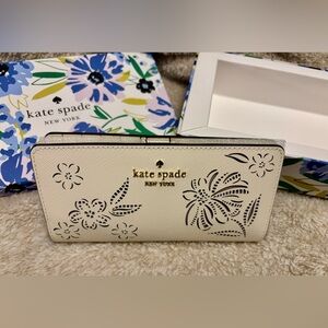 New w/ Tags Kate Spade cream wallet with black floral laser-cut detailing